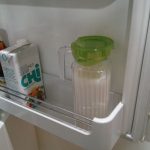 View of a jug of almond milk stored in a frdge.