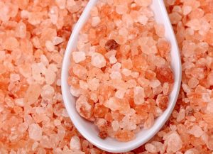 a white spoonful of pink himalayan salt